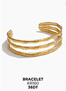 Bracelet manchette doré à effet bambou